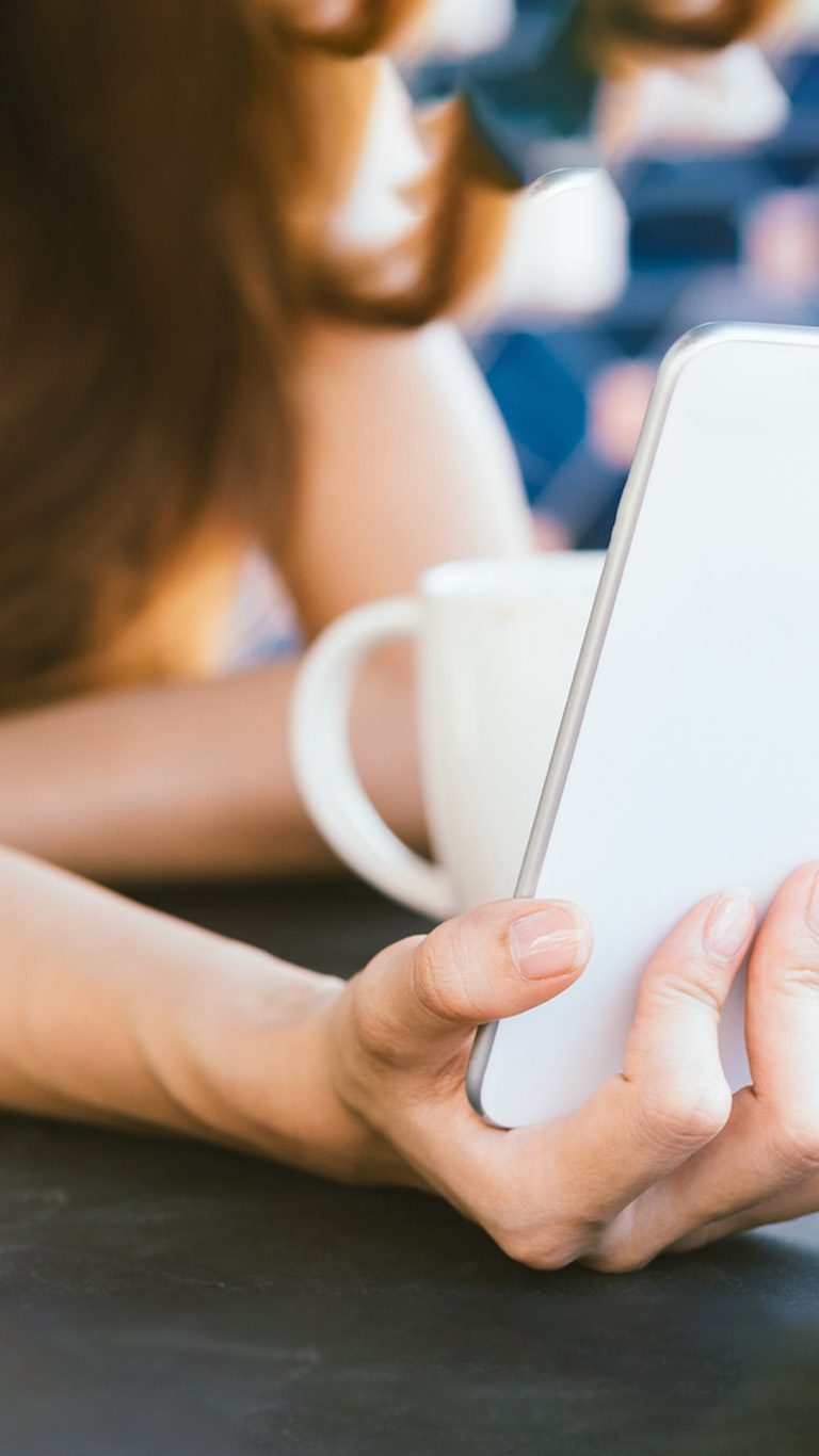 smartphone-on-hand-vert